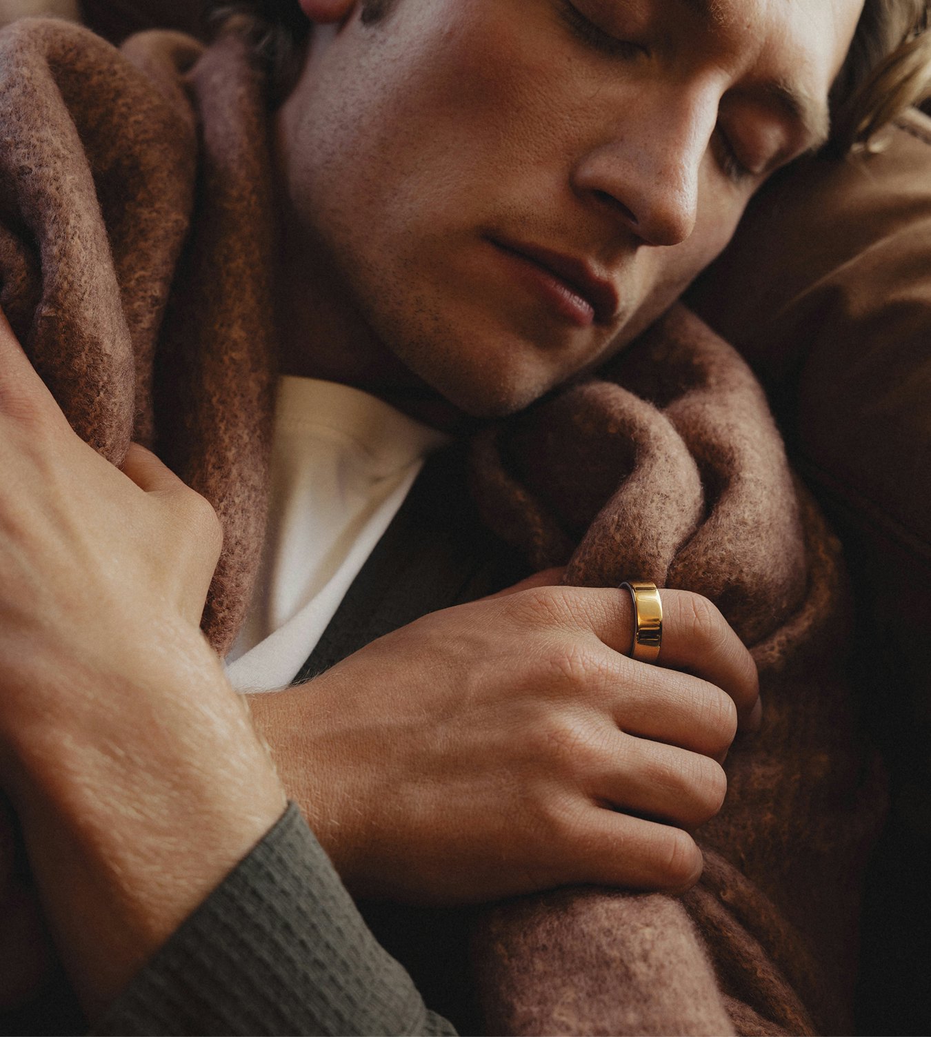 Man reaches for a tissue while wearing his Oura ring